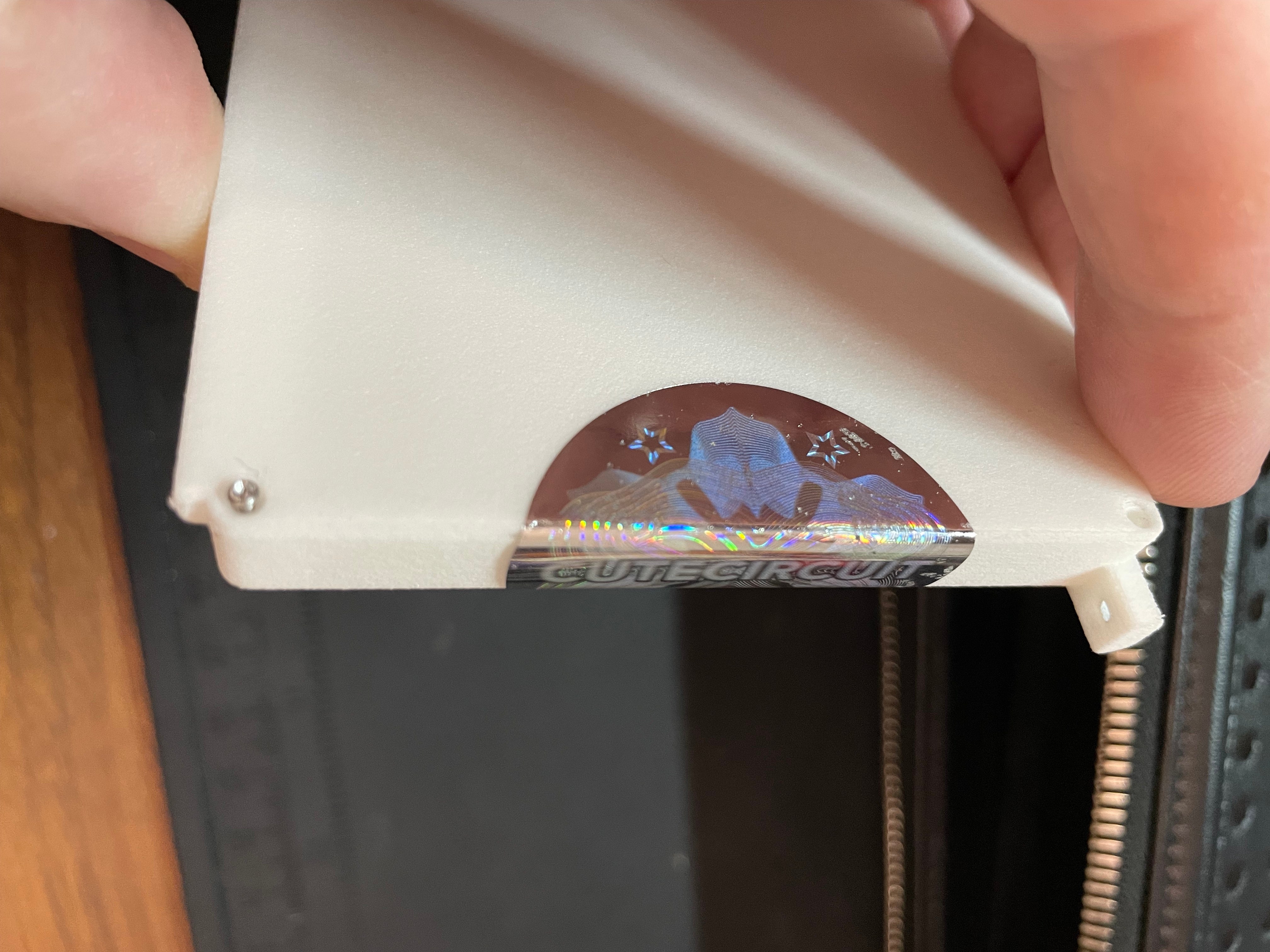 close-up of the CUTECIRCUIT holographic sticker