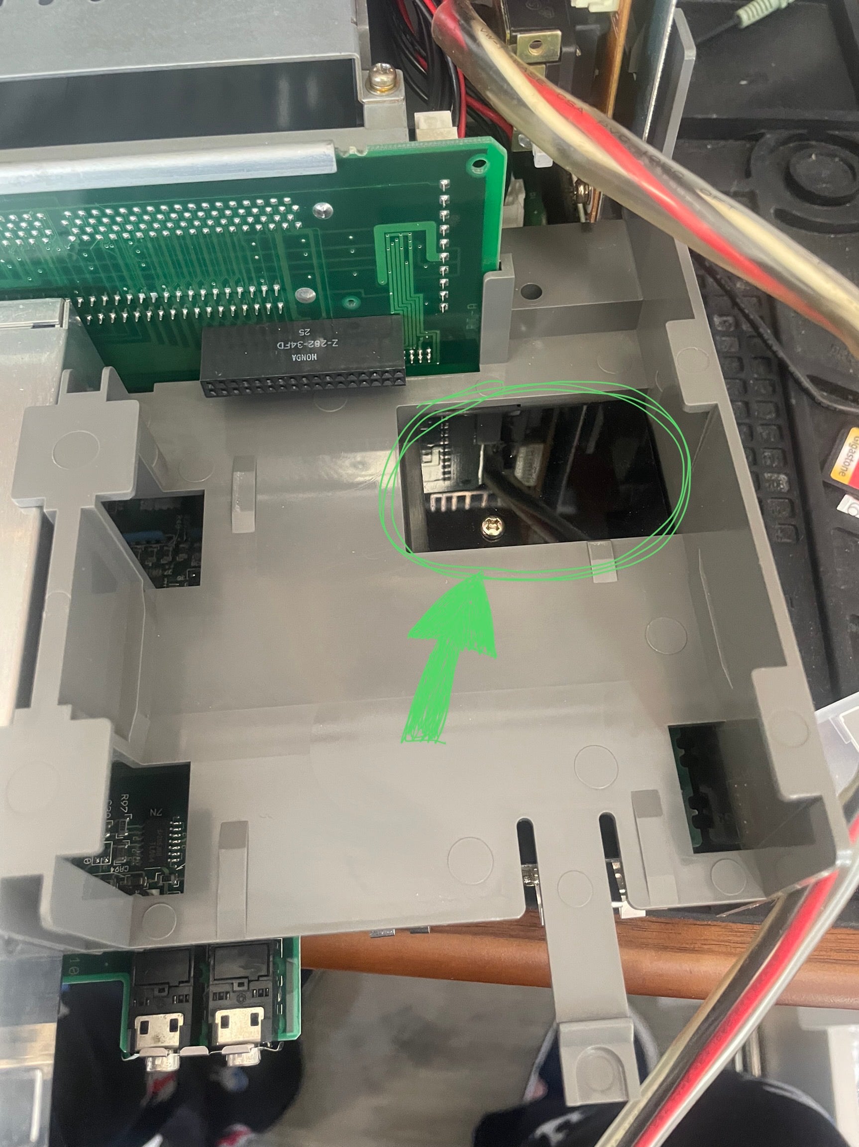 Floppy drive removed, showing the CMOS door beneath it